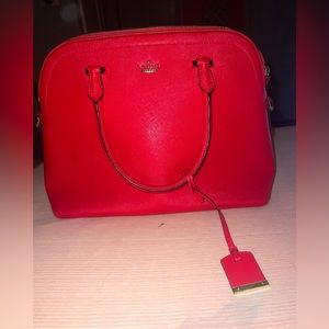 Red Kate Spade bag with silver & gold hardware